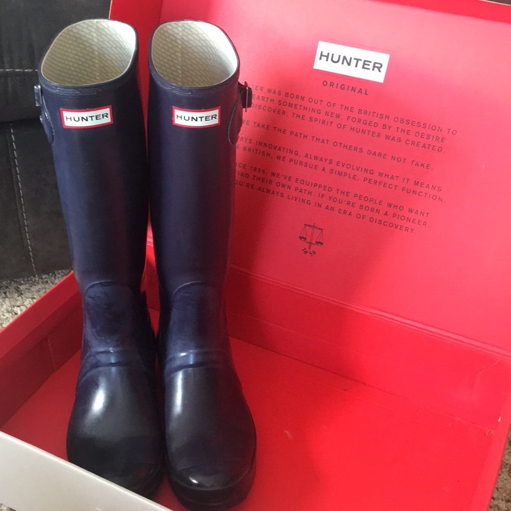 Tall glossy Hunter Wellington rain boots
